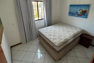 Uma cama ou camas num quarto em Apartamento com vista mar frente a avenida principal