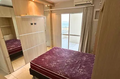 Uma cama ou camas num quarto em Cobertura com piscina e vista mar