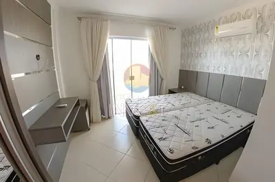 Uma cama ou camas num quarto em Cobertura com vista mar e excelente localização