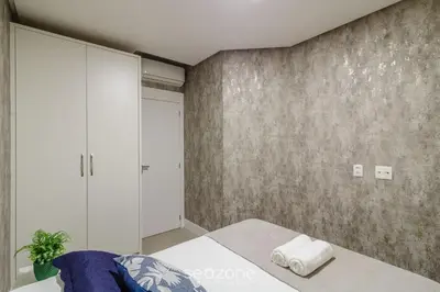 Uma cama ou camas num quarto em CSD - Apartamentos próximos à praia de Bombas