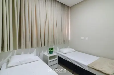 Uma cama ou camas num quarto em CSD - Apartamentos próximos à praia de Bombas