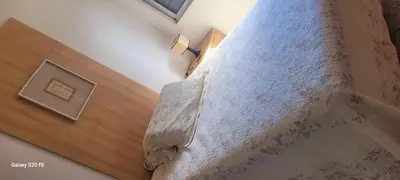 Uma cama ou camas num quarto em Casa Ensolarada