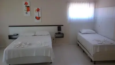 Uma cama ou camas num quarto em Pousada Mar Azul
