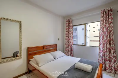 Uma cama ou camas num quarto em Apto 3Q c/ varanda - 240m do mar Meia Praia EIO203