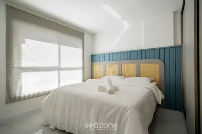 Uma cama ou camas num quarto em Apto moderno c/vista mar em Porto Belo SC MRE801