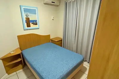 Uma cama ou camas num quarto em Apartamento com vista mar e excelente localização