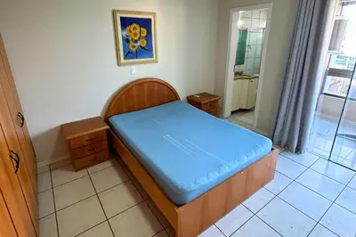 Uma cama ou camas num quarto em Apartamento com vista mar e excelente localização