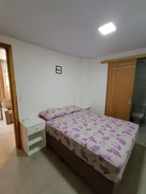 Uma cama ou camas num quarto em Apartamentos Lagoinha