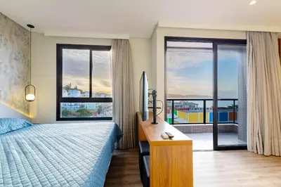 Uma cama ou camas num quarto em Confortável Loft Duplex em Condomínio com Piscina