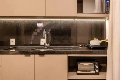 A cozinha ou kitchenette de Confortável Loft Duplex em Condomínio com Piscina