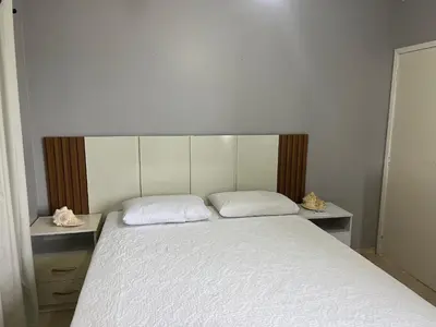 Uma cama ou camas num quarto em 413 - Casa frente Mar em Bombas-Bombinhas.