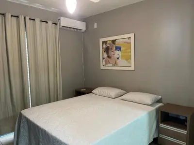 Uma cama ou camas num quarto em 413 - Casa frente Mar em Bombas-Bombinhas.