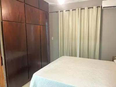 Uma cama ou camas num quarto em 413 - Casa frente Mar em Bombas-Bombinhas.