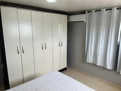 Uma cama ou camas num quarto em 413 - Casa frente Mar em Bombas-Bombinhas.