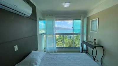 Uma cama ou camas num quarto em Bela Vista - Bombinhas - SC