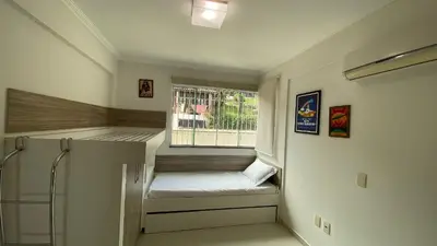 Uma cama ou camas num quarto em Bela Vista - Bombinhas - SC