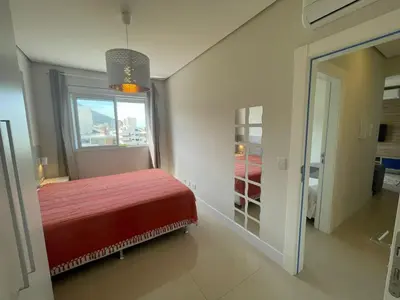 Uma cama ou camas num quarto em cód 22 - Apartamente frente mar deslumbrante