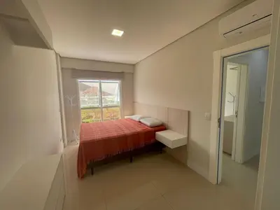 Uma cama ou camas num quarto em Cód 23 - Apartamento com vista para o mar