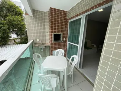 Uma televisão e/ou sistema de entretenimento em Cód 33 - Apartamento a 80 metros do Mar