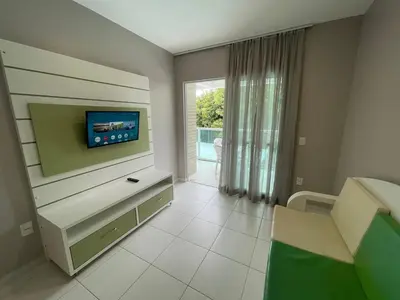 Uma televisão e/ou sistema de entretenimento em Cód 35 - Apartamento a 80 metros do Mar