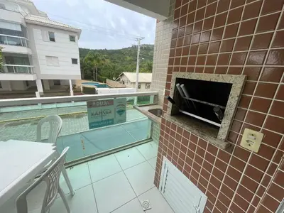 Uma televisão e/ou sistema de entretenimento em Cód 35 - Apartamento a 80 metros do Mar
