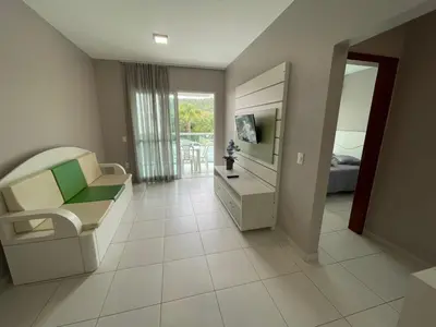Uma televisão e/ou sistema de entretenimento em Cód 36 - Apartamento a 80 metros do Mar