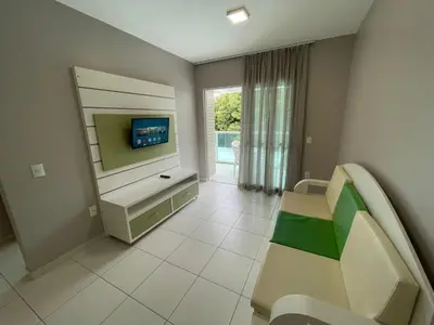 Uma televisão e/ou sistema de entretenimento em Cód 38 - Apartamento a 80 metros do Mar