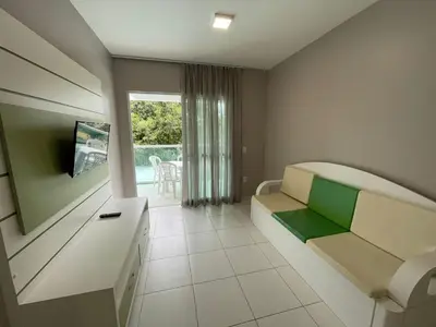 Uma televisão e/ou sistema de entretenimento em Cód 38 - Apartamento a 80 metros do Mar