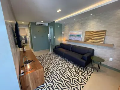 Uma televisão e/ou sistema de entretenimento em cód 32 - Apartamento á 100 m do mar com vista