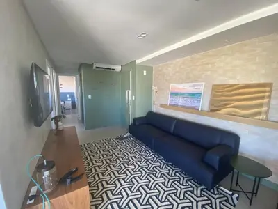Uma televisão e/ou sistema de entretenimento em cód 32 - Apartamento á 100 m do mar com vista
