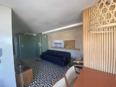 Uma área de estar em cód 32 - Apartamento á 100 m do mar com vista