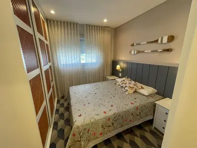 Uma cama ou camas num quarto em cód 32 - Apartamento á 100 m do mar com vista