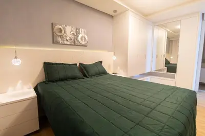 Uma cama ou camas num quarto em Varandas do Atlântico 101A – Frente Mar em Bombas