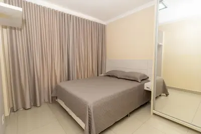 Uma cama ou camas num quarto em 379 - Maravilhoso apto 2 quartos na Lagoinha