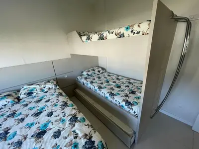 Uma cama ou camas num quarto em cód 56 - Apartamento á 300M do mar