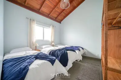 Uma cama ou camas num quarto em Casa na beira da praia do Perequê SC AAF378