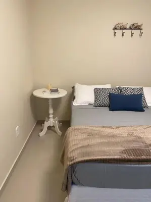 Uma cama ou camas num quarto em Apto Centro Bombinhas