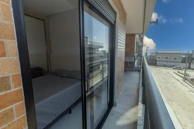 Uma varanda ou terraço em 139C - lindo apartamento a 50m da praia de Canto Grande