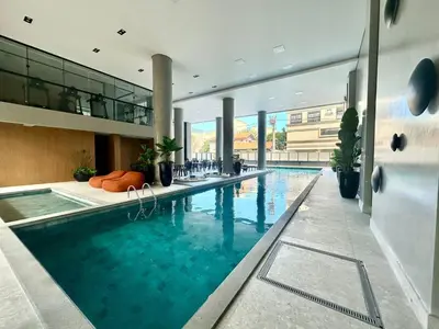 A piscina em ou perto de 139C - lindo apartamento a 50m da praia de Canto Grande
