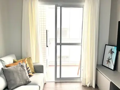 Uma televisão e/ou sistema de entretenimento em Lindo! Apto com piscina na praia de Palmas! SV01H