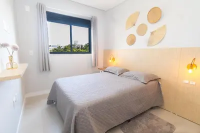Uma cama ou camas num quarto em 223F - Belíssimo Apartamento em Canto Grande