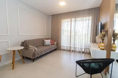 Uma área de estar em 223F - Belíssimo Apartamento em Canto Grande