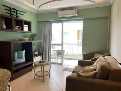 Uma área de estar em 318 - Apartamento 02 Dormitórios com Piscina