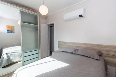 Uma cama ou camas num quarto em 371 - Apartamento 3 dormitórios na praia de Bombas