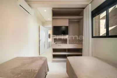 Uma cama ou camas num quarto em 504 Bl 02 - WaldGarten Bombinhas - 50 m do Mar e Frente Avenida - Condomínio de Alto Padrão - Piscina - Academia - Salão de jogos