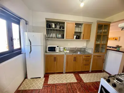 A cozinha ou kitchenette de Residencial Ide Martins a 30 metros da Praia de Bombinhas e próximo a Praia da Lagoinha