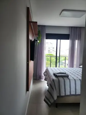 Uma cama ou camas num quarto em IMPRESSIONANTE DUPLEX PRÓXIMO AO MAR, 3 SUÍTES, Apt 407