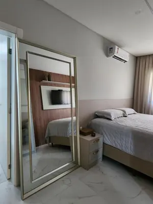 Uma cama ou camas num quarto em TÉRREO EXCLUSIVO À BEIRA MAR E 3 SUÍTES , Apt 101 Mariscal