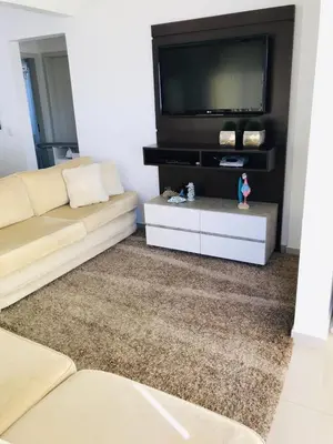 Uma televisão e/ou sistema de entretenimento em Apartamento Praia de Porto Belo, Balneario Pereque, SC
