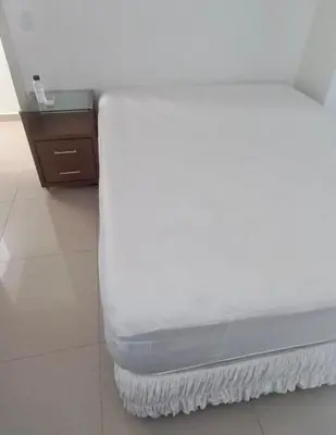 Uma cama ou camas num quarto em Apartamento Praia de Porto Belo, Balneario Pereque, SC